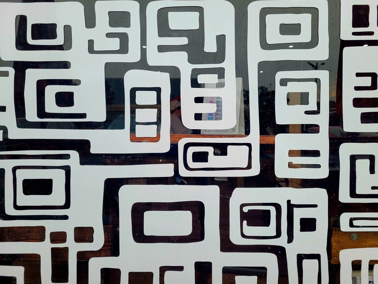 QR code sticker on a large retail store window display
