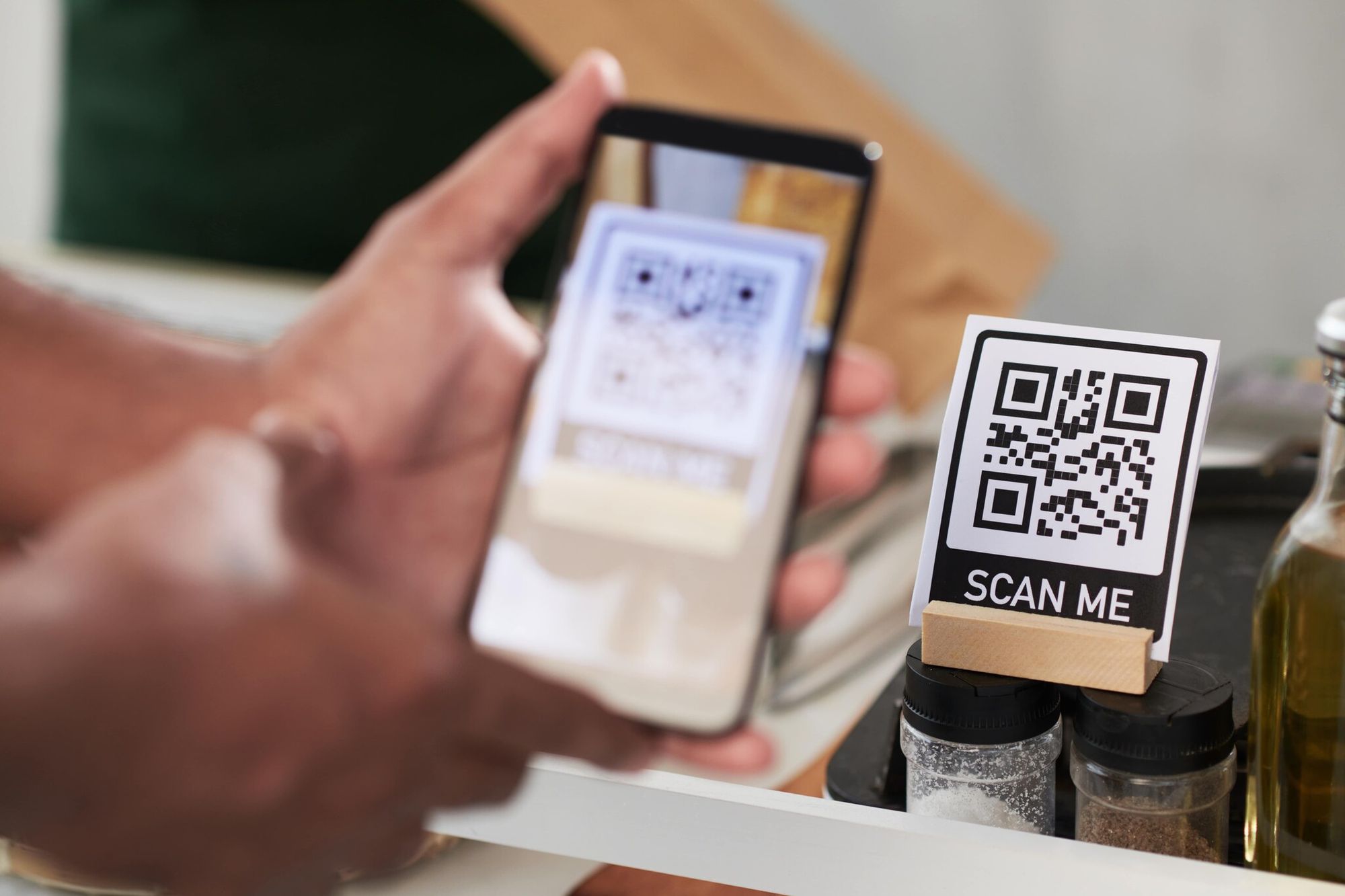 customer scanning a QR code on the counter