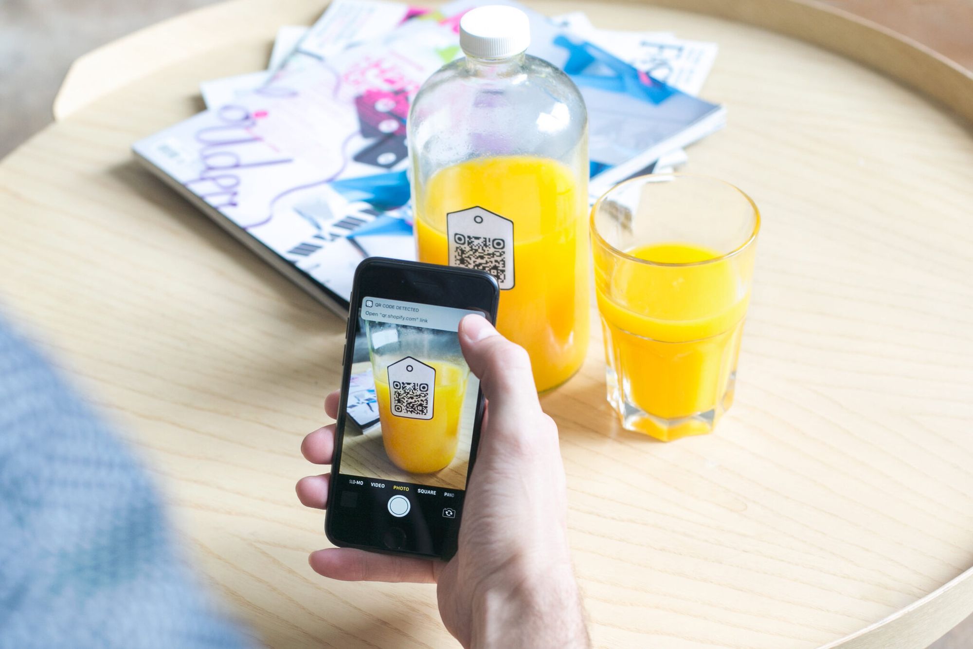 a juice bottle with a QR code as a business card alternative
