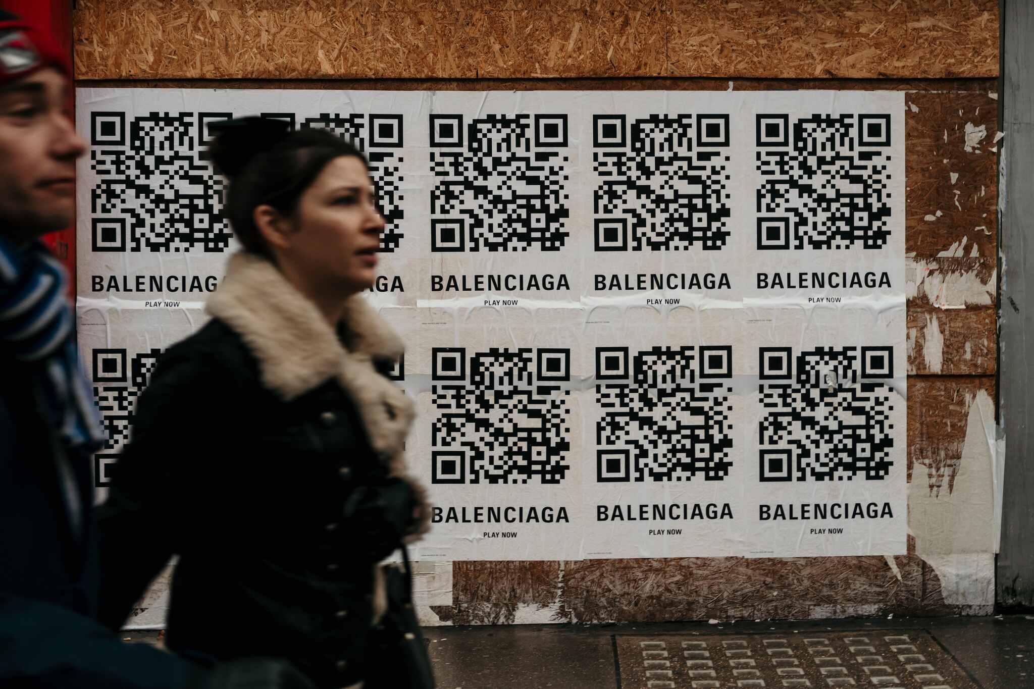 Balenciaga QR code ad with two people walking