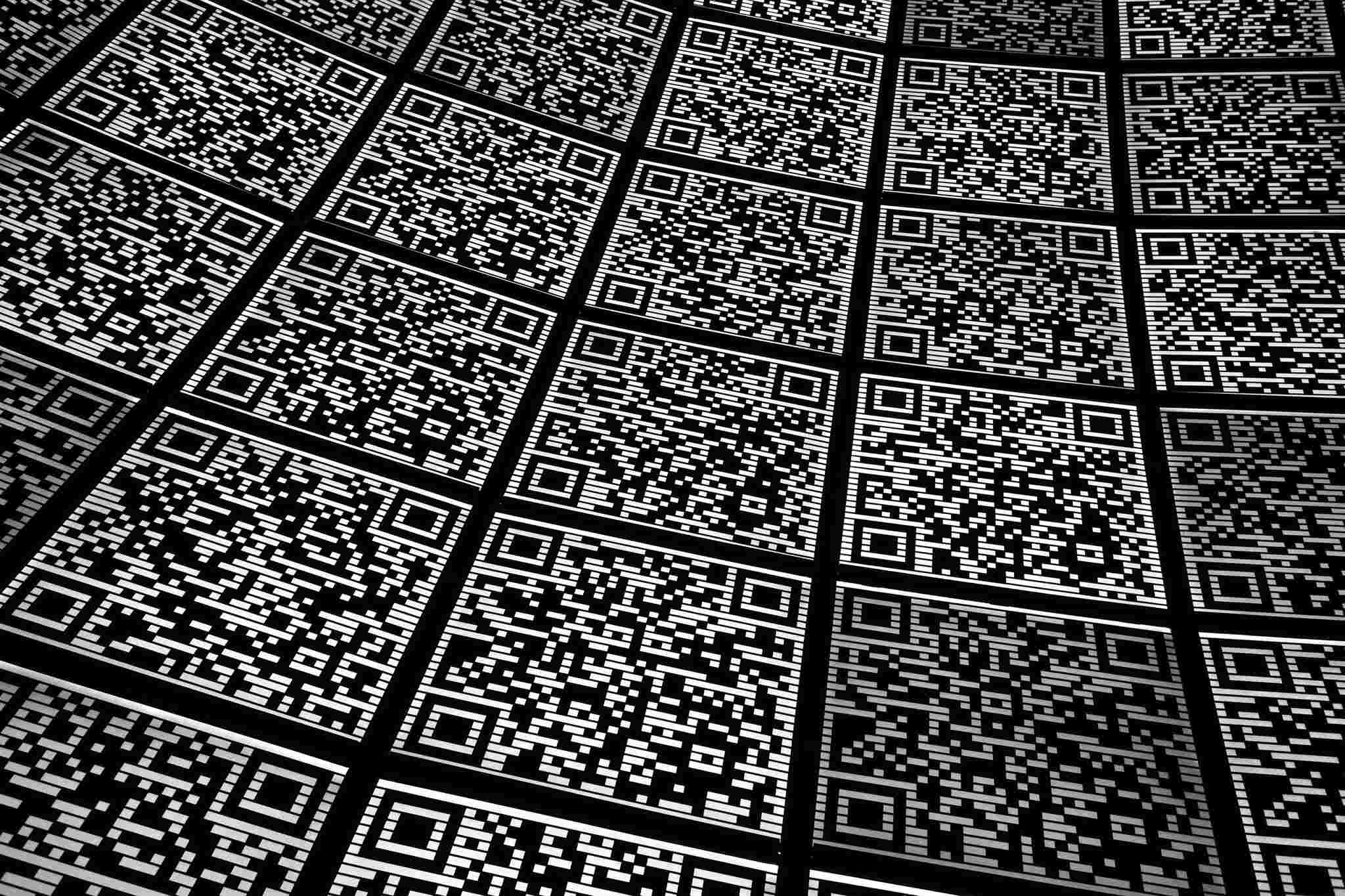 Close-up abstract QR code pattern showing module detail and quiet zone at minimum printable size