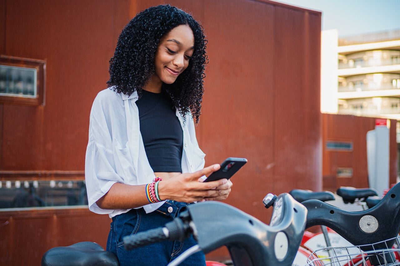 Girl scanning a QR code and smiling