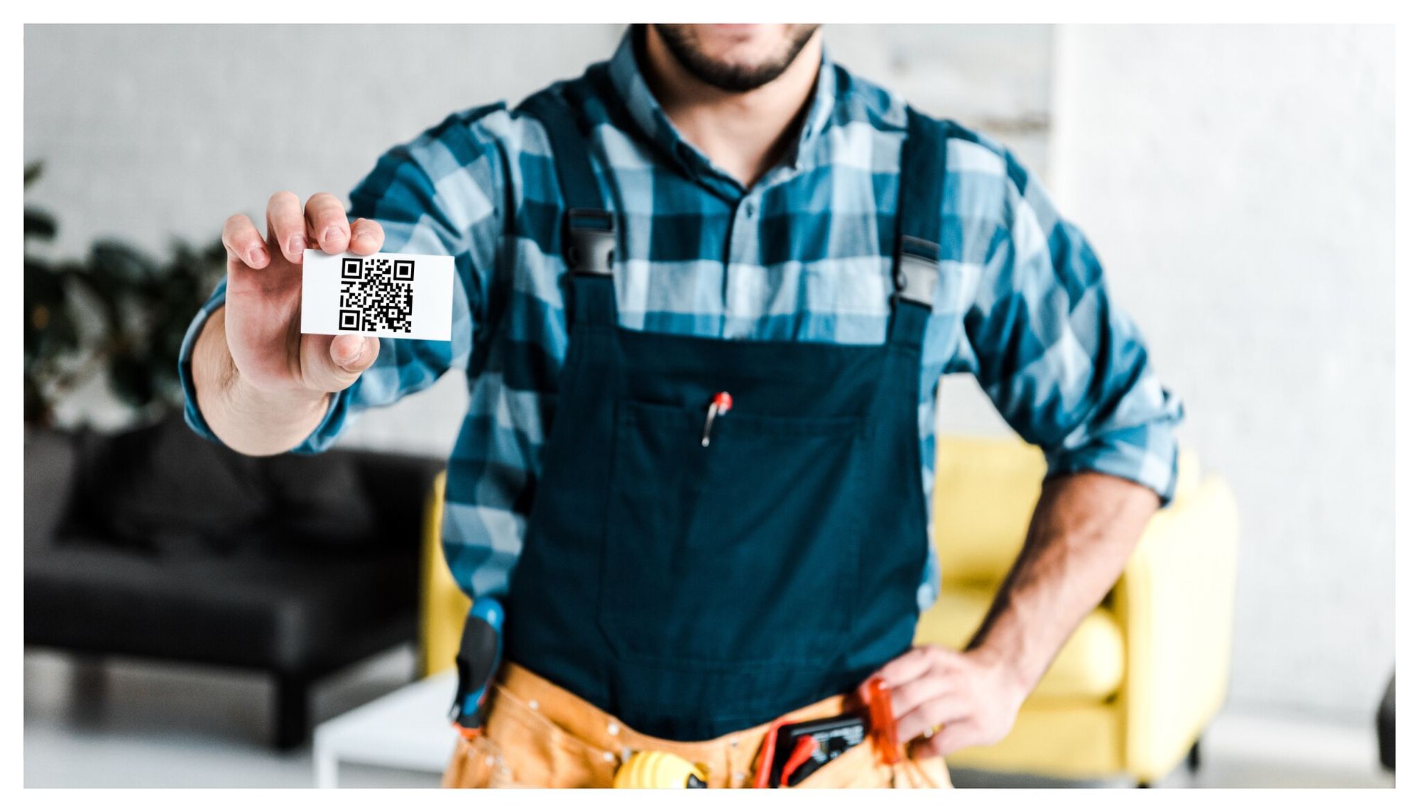 A man displaying a folded card with a QR code
