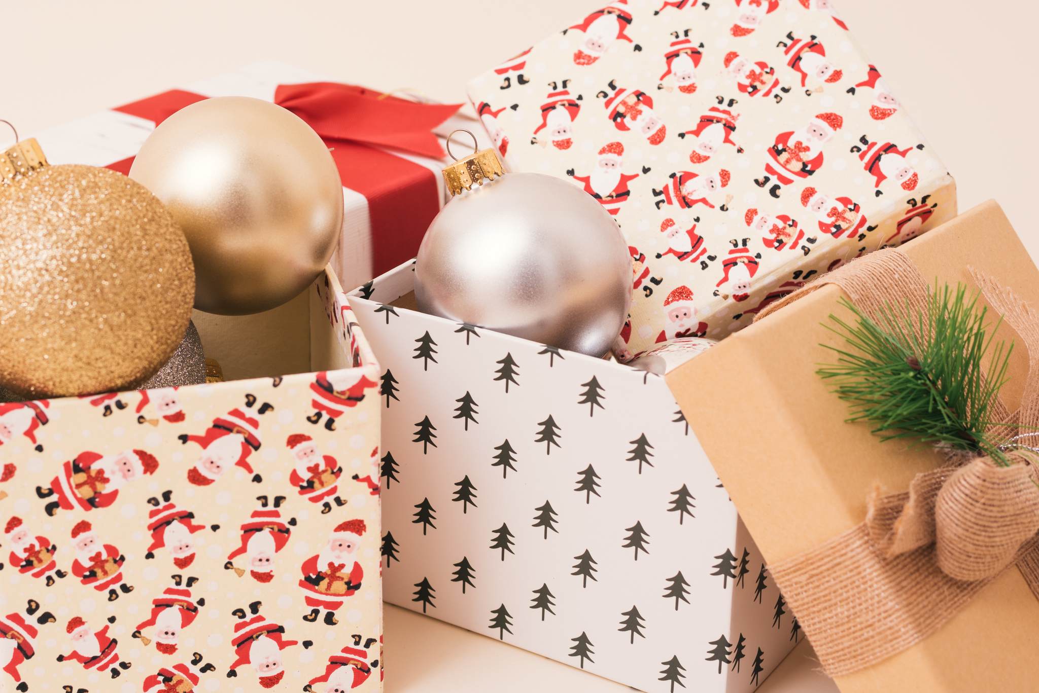 Christmas themed gift boxes with Christmas ornaments