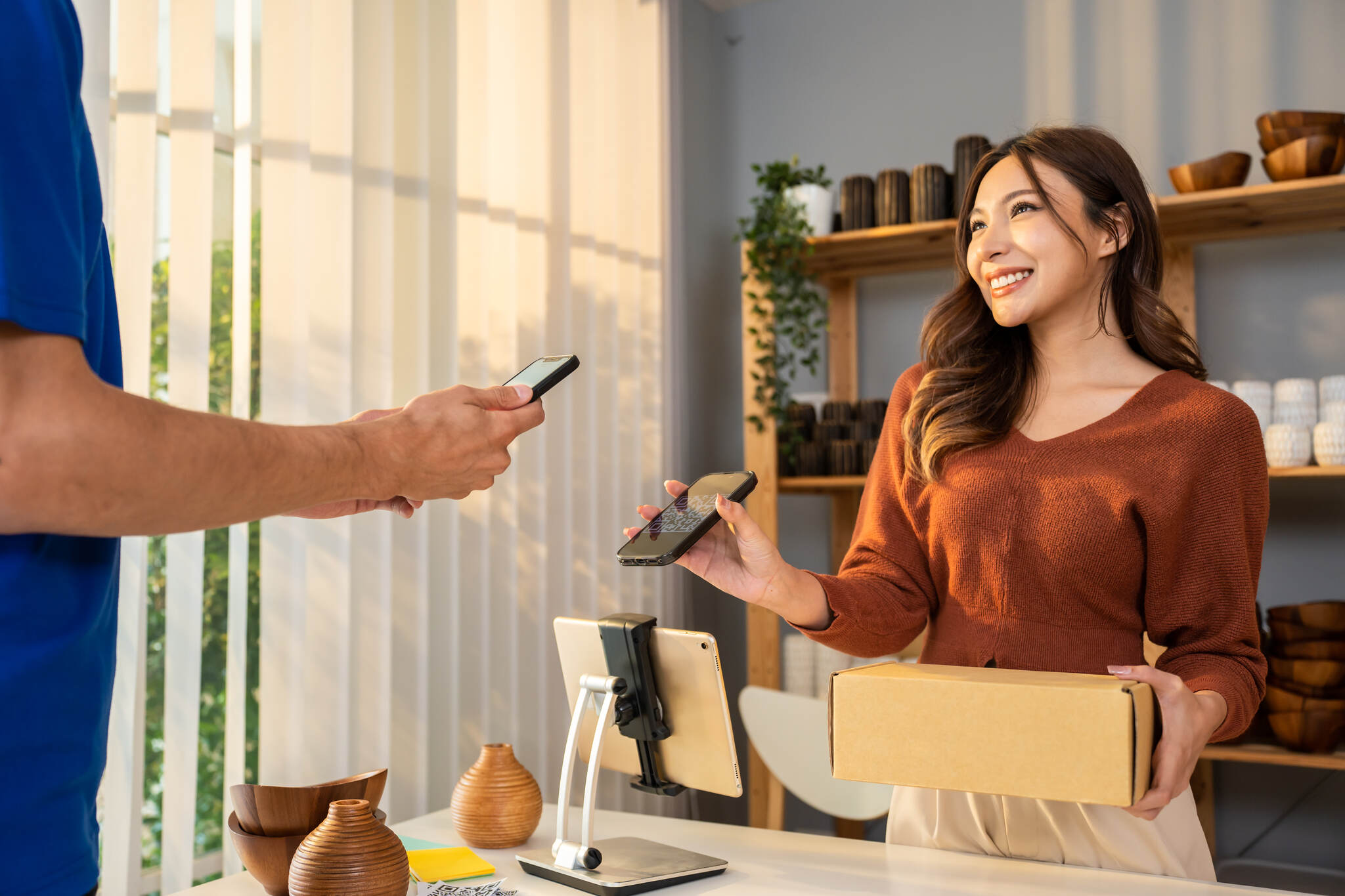 customer using mobile phone and QR code for paying