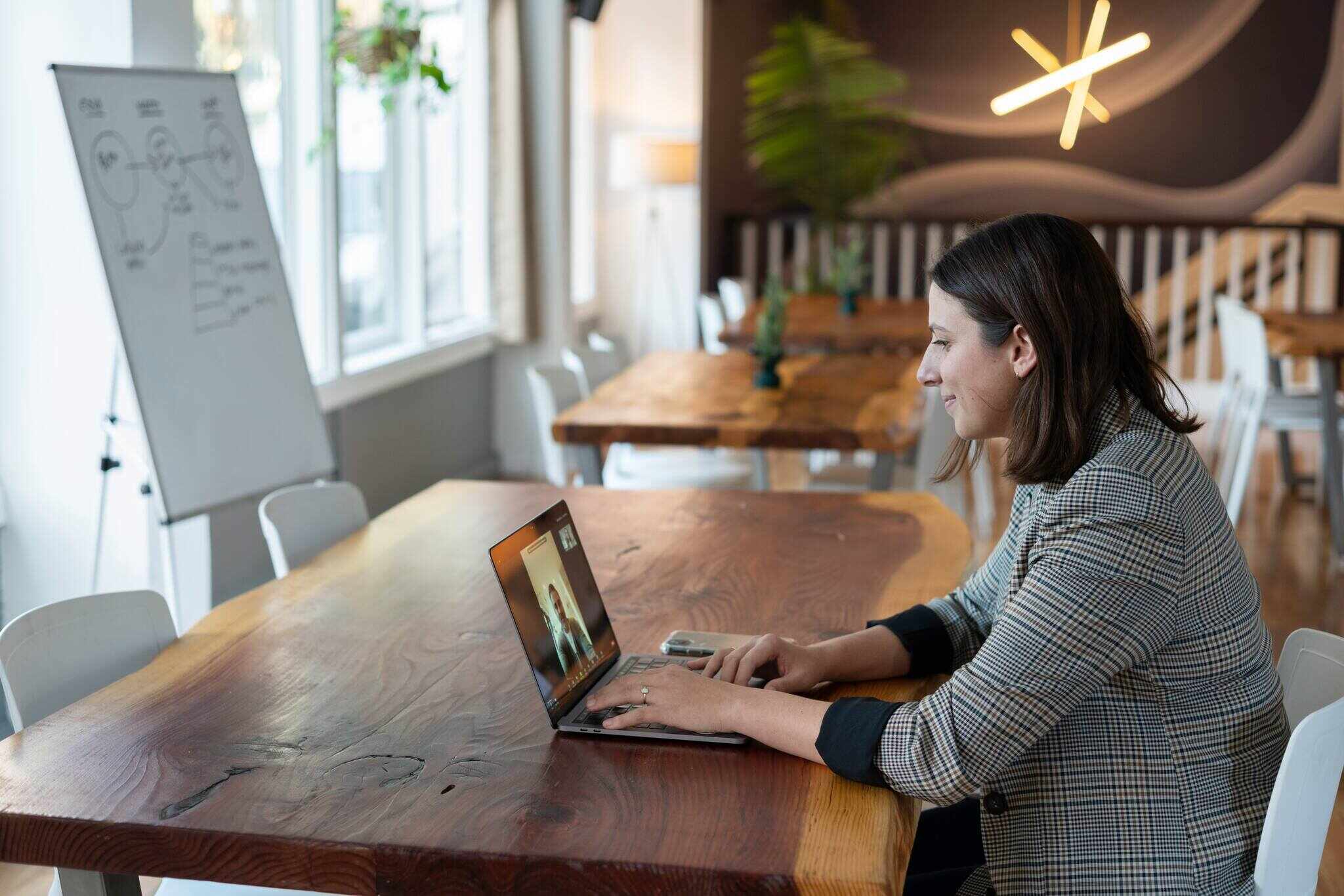 a woman having a video call and smiling