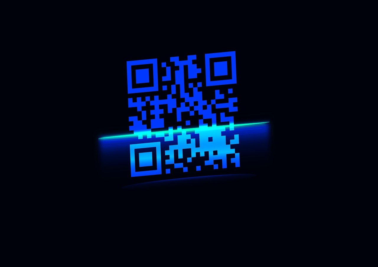 A close-up of a smartphone scanning a printed QR code with the scanner overlay visible on screen