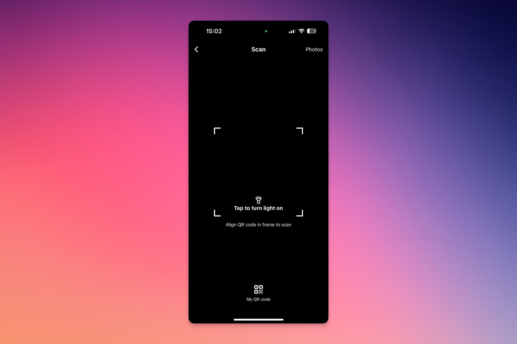 Scanning a friend's QR code with the TikTok in-app scanner viewfinder