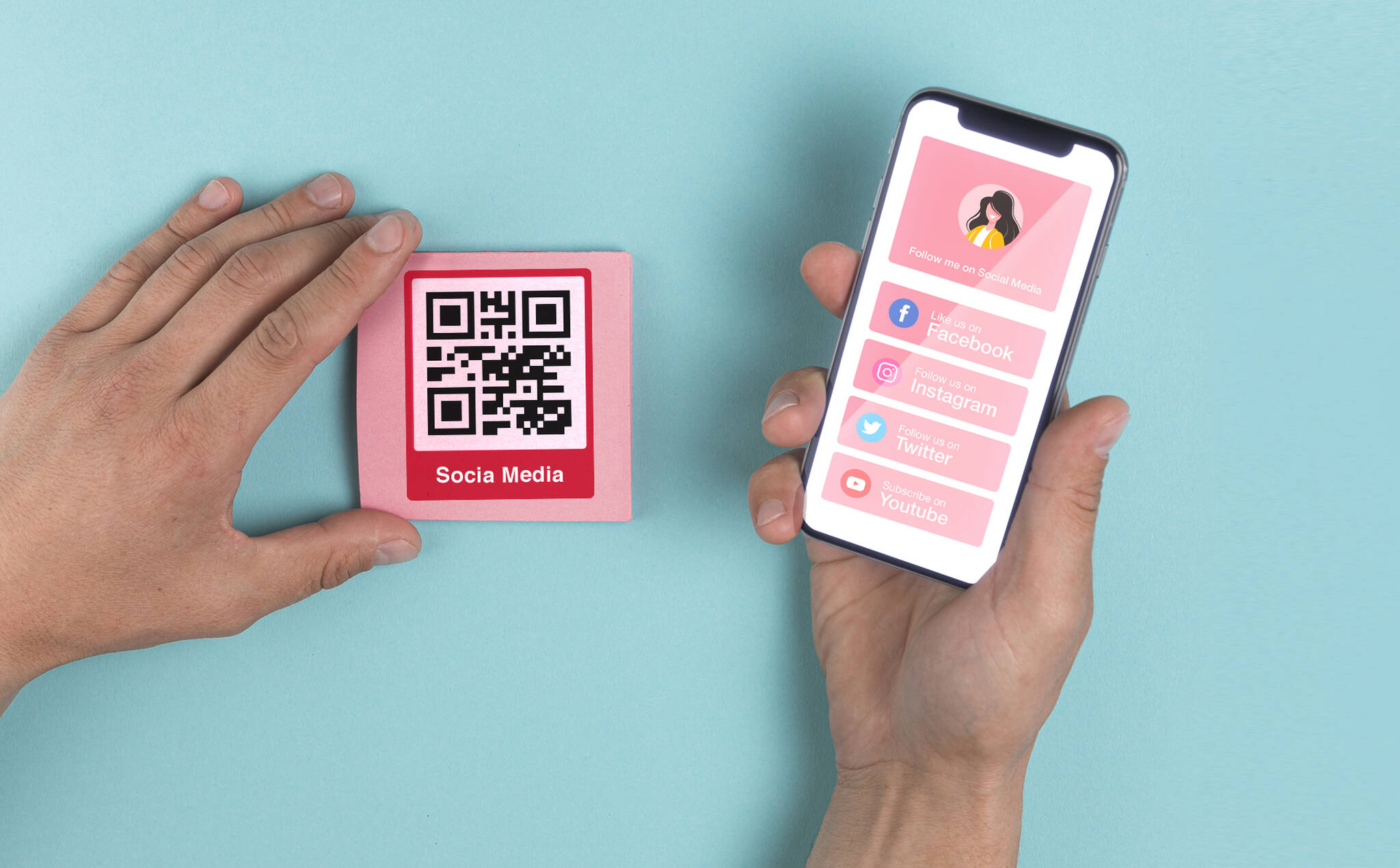 social media QR code example and a phone next to it